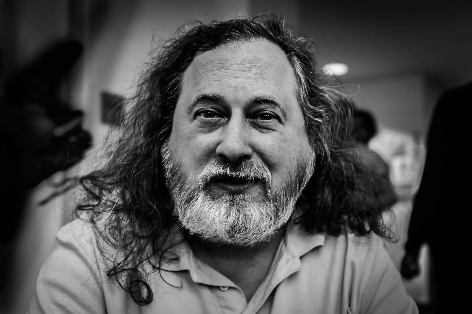 Black and white portrait of Richard Stallman, with a beard and long hair
